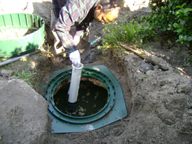 Installing a septic filter in the outgoing baffle to prevent debris from reaching the drainfield