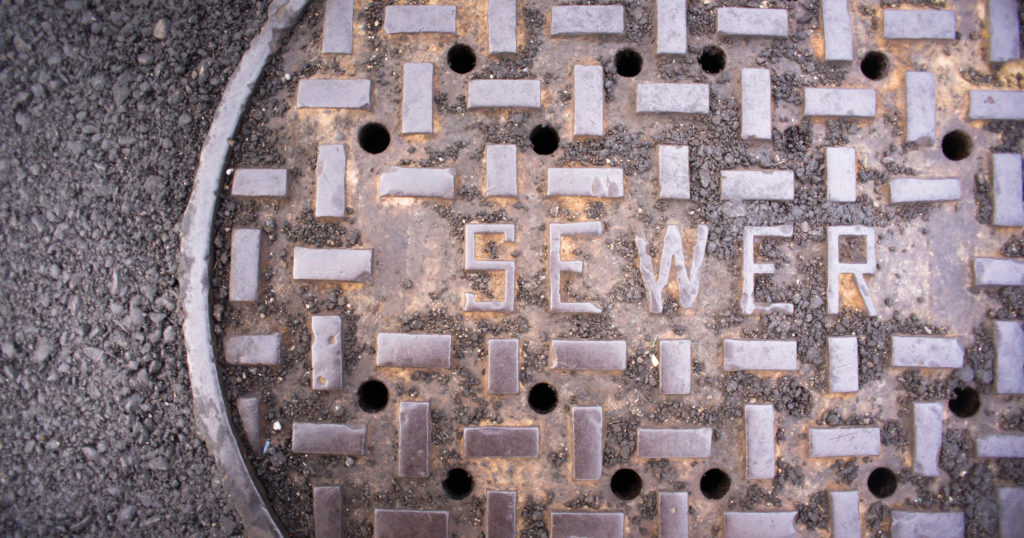 Close up of a manhole sewer cover